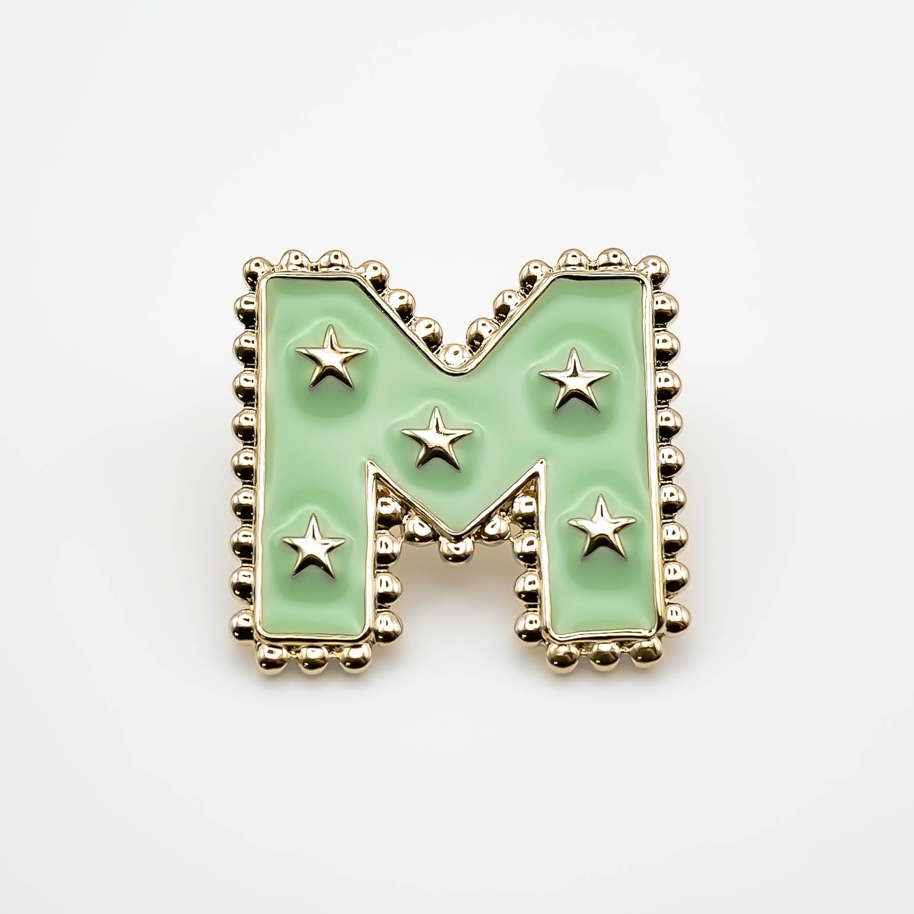 Pin's M